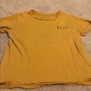 A billabong T-shirt, that’s mustard color.